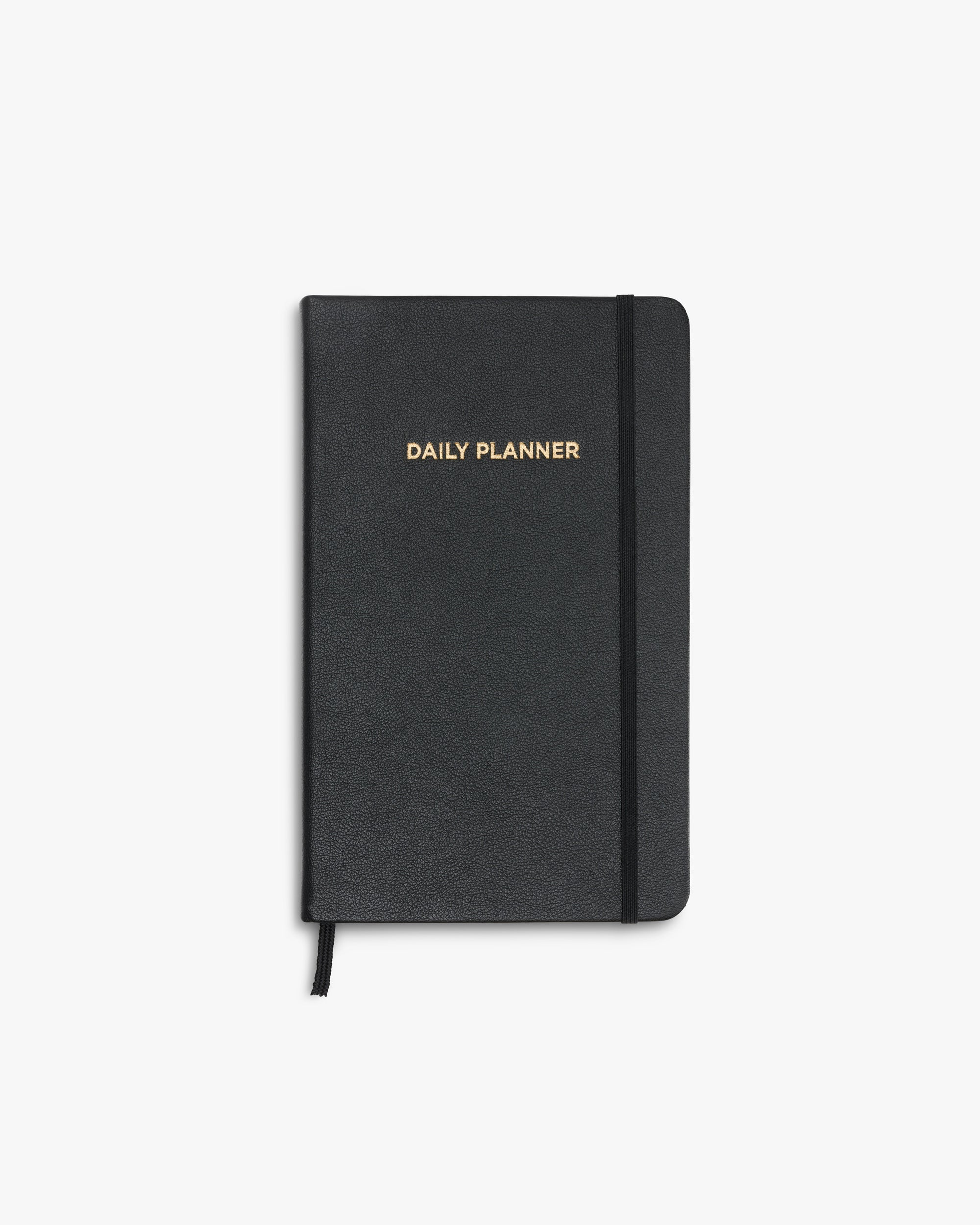 Schwarzer Daily Planner mit goldener Prägung auf dem Cover, frontal aufgenommen.