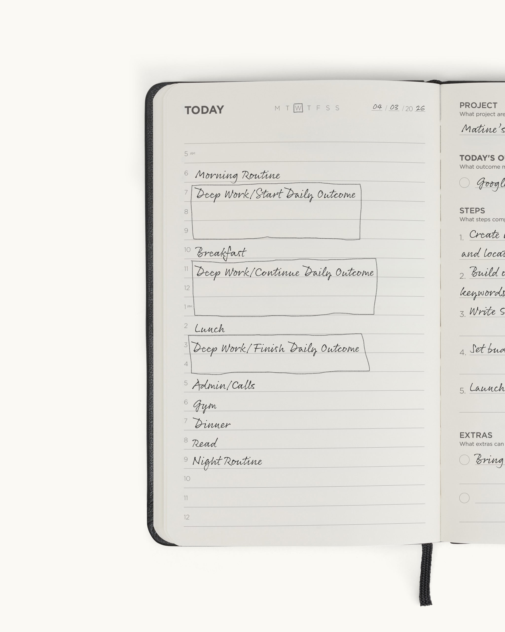 Open spread of the black Matine Daily Planner showing the filled “Today” schedule page with handwritten time blocks and ribbon bookmark visible.